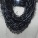 Sciarpa collana fatta a mano grigio-nero con lamè