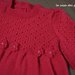 Vestitino di lana rossa con fiorellini e perline realizzato ai ferri