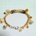 braccialetto con pendenti di cristalli e perle color oro bianco e bronzo  FATTO A MANO!