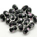 Perla ovale in vetro nero con fiore rosa 14×10mm