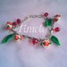 bracciale con perline decorate in fiori e foglioline in fimo