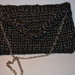 Pochette di lana con apertura a triangolo (color nera con fili lucidi grigi)