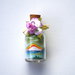 Bottiglie con paesaggi - bomboniera- in sabbia mod. Piccolo con Arcobaleno