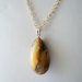 Ciondolo grande ambra baltica naturale con collana in argento 925 dorata