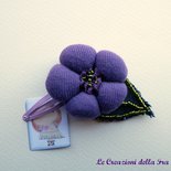 Molletta con fiore in tessuto viola