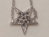 Anello stella in argento 925 e Cubic Zirconia bianchi e neri.
