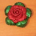 Rosa rossa decorata con porporina e paillettes