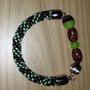 Bracciale kumihimo verde e marrone realizzato a mano con perline