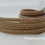 bracciale modello alcantara tonalità beige chiaro con borchie color oro 