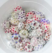 perle multicolori,in acrilico,in acciaio intagliato, e distanziatori swarovsky  