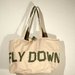 Borsa "Fly down" in cotone beige con scritta 