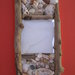 Specchio con conchiglie e legnetti di mare 