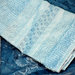 Asciugamani azzurri ricamati punto filza