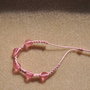 BRACCIALE FATTO A MANO CON PERLE TRASPARENTI ROSA E TECNICA MACRAME'