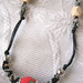 Parure collana e bracciale doppio giro, perle grandi ricoperte di stoffa e poligoni in legno naturale