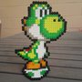 action figure di yoshi con base a uovo