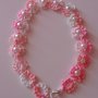 Grazioso braccialetto a fiori rosa con perla centrale