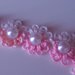 Grazioso braccialetto a fiori rosa con perla centrale