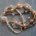 Elegante braccialetto a quattro fili con perle bianche, perle rosate,pietre dure, elementi Svarowski. Chiusura magnetica.