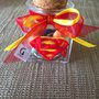 Bomboniera  in vetro con tappo di sughero decorata con stemma di Superman realizzato interamente a mano in pasta FIMO