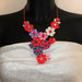 Collana kanzashi fatta a mano con fiori colore corallo, rosa, lilla, bianco