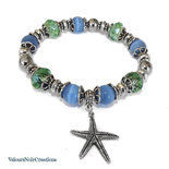 Bracciale con ciondolo stella marina, perle azzurre e cristalli verdi 