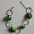 Bracciale con gettoni in fimo verde e cerchi