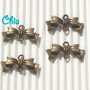 12 charms connettori link fiocchetto bronzo