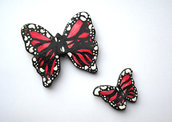 Decorazione farfalle rosse da parete modellate con la porcellana fredda e dipinte a mano