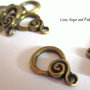 Chiusura a "T" color bronzo "vortice" (18x11mm) (cod.30473)