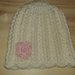 Cappello 6-9 mesi in pura lana bianco con fiore rosa