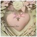 Cuore/fiocco nascita in vimini con roselline ,farfalle e un cuore rosa