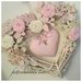Cuore/fiocco nascita in vimini con roselline ,farfalle e un cuore rosa
