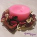 Candela rosa con decorazione pot pourri, bacche e fiori
