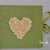 Album foto artigianale verde con un “cuore di fiori” 