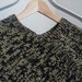 Poncho in lana nero/beige con frange