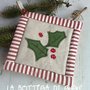 Presina natalizia con ramo di trifoglio e bordo patchwork