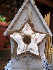 Stella su stella juta e cotone per decorare la casa per le feste di Natale
