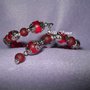 bracciale a molla perle rosse