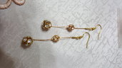 orecchini pendenti con palline di swarovski e cobra color oro