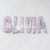 OLIVIA: una ghirlanda di lettere imbottite lilla e glicine per decorare la sua cameretta