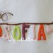SOFIA: una ghirlanda di lettere in stoffa colorate come appoggio per due gufetti!