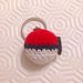 Portachiavi con pokéball amigurumi, rossa bianca e nera, fatta a mano all'uncinetto