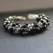 Bracciale con cristalli metallic argento e perle nere
