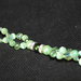 Braccialetto con perle verde chiaro e cristalli verdi