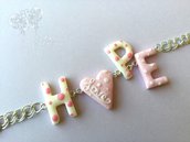Bracciale rosa e bianco con scritta HOPE - speranza - in pasta polimerica