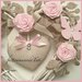 Cuore/fiocco nascita in vimini con rose,farfalle e due cuori imbottiti sui toni del rosa e beige