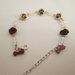 Bracciale in cristalli, perline e bottoni decorativi
