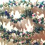 Bracciale a 4 file di corallini su varie sfumature dell'azzurro verde rosa e grigio