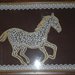 Quadro Pergamena con raffigurato un Cavallo